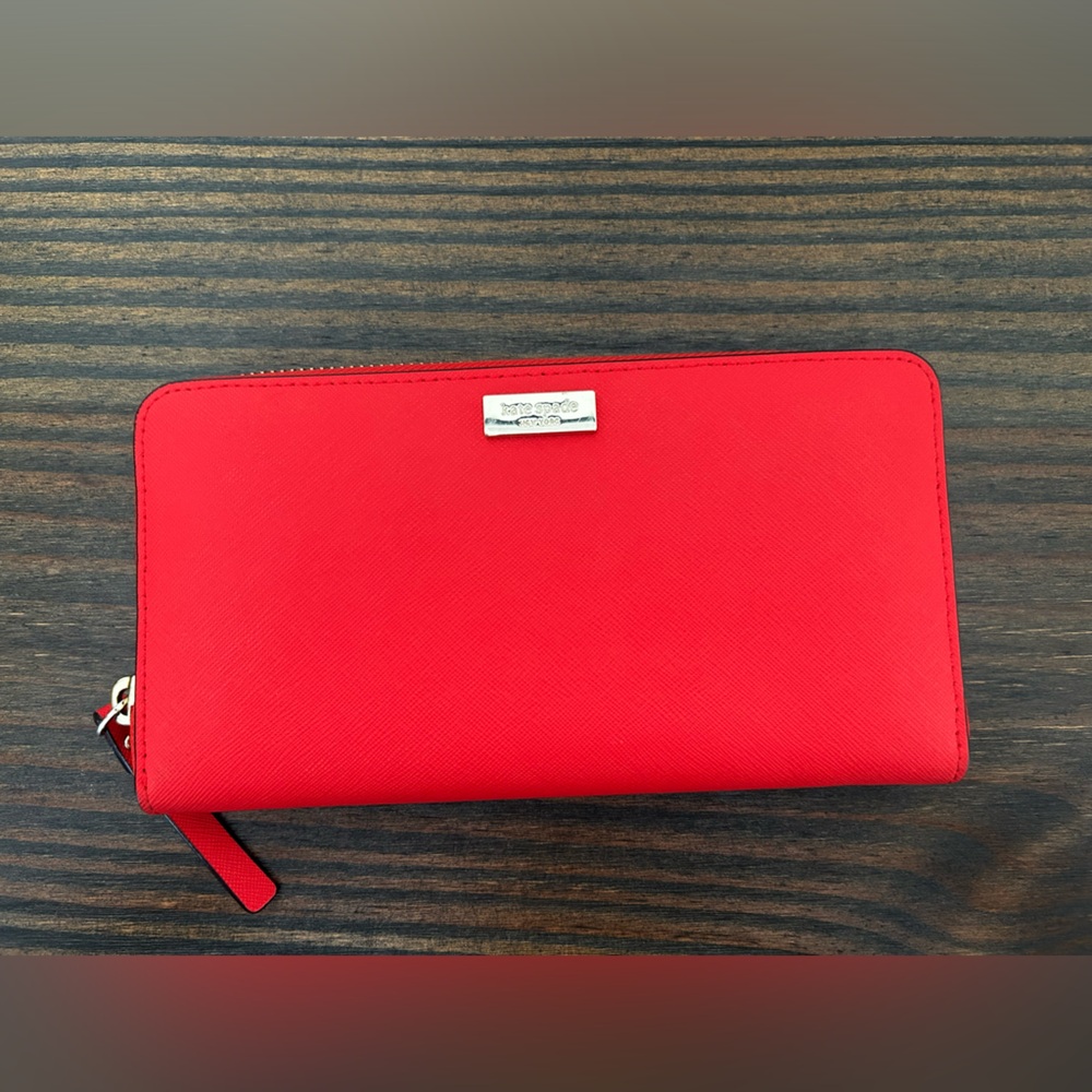 Kate Spade hot pink zip around wallet. 6 large slots. Great condition.